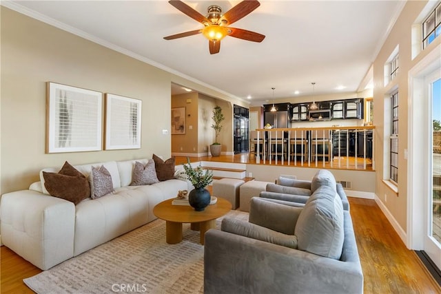 10885 San Marcos Rd, Atascadero, CA 93422 - living room featuring wood finished floors, crown molding, ceiling fan, and baseboards