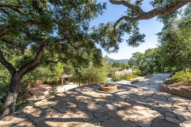 10885 San Marcos Rd, Atascadero, CA 93422 - view of patio featuring a fire pit, a gazebo, and a mountain view