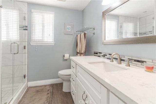 36755 Tierra Subida Ave, Palmdale, CA 93551 - bathroom featuring plenty of natural light, a shower stall, baseboards, and vanity