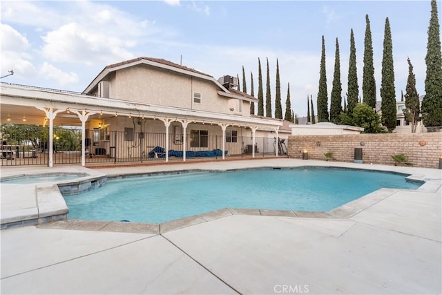36755 Tierra Subida Ave, Palmdale, CA 93551 - view of pool featuring fence, a patio area, a pool with connected hot tub, and central air condition unit