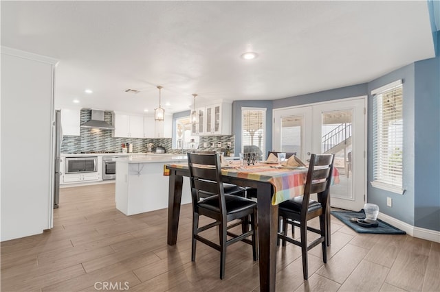 36755 Tierra Subida Ave, Palmdale, CA 93551 - dining area with light wood-style floors, recessed lighting, baseboards, and french doors