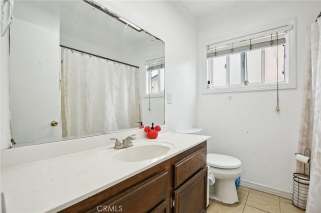 3686 Palo Verde Ave, Long Beach, CA 90808 - bathroom featuring tile patterned floors, vanity, and toilet