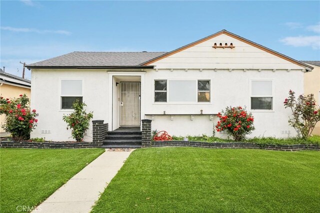 3686 Palo Verde Ave, Long Beach, CA 90808 - bungalow featuring a front lawn, stucco siding, and roof with shingles