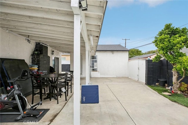 3686 Palo Verde Ave, Long Beach, CA 90808 - view of patio / terrace featuring fence, a gate, and outdoor dining space
