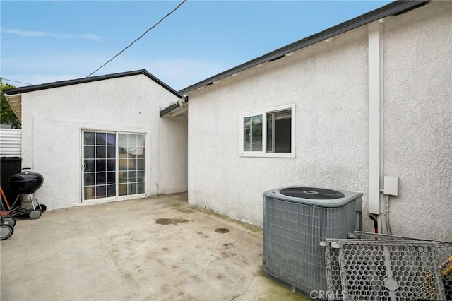 3686 Palo Verde Ave, Long Beach, CA 90808 - rear view of house with stucco siding, central AC, and a patio area