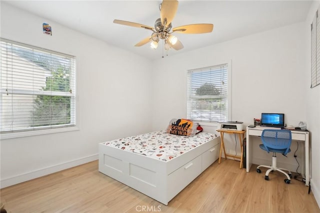 3686 Palo Verde Ave, Long Beach, CA 90808 - bedroom featuring light wood-type flooring, baseboards, a desk, and a ceiling fan