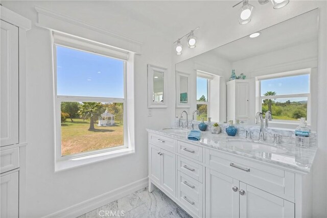 22252 Monte Rancho Dr, Temecula, CA 92590 - bathroom featuring marble finish floors, baseboards, double vanity, and recessed lighting