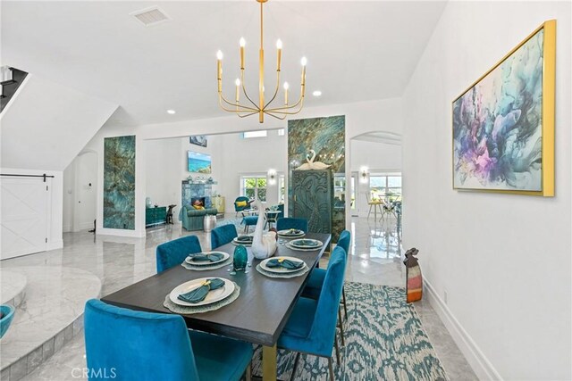22252 Monte Rancho Dr, Temecula, CA 92590 - dining room featuring a chandelier, arched walkways, recessed lighting, marble tiled flooring, and baseboards