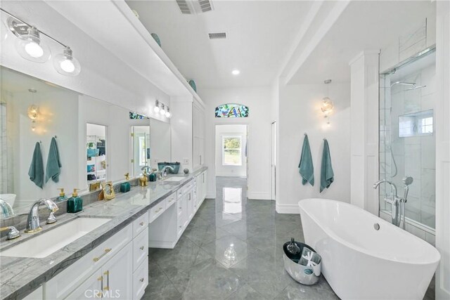 22252 Monte Rancho Dr, Temecula, CA 92590 - bathroom with a soaking tub, double vanity, marble tiled floors, a stall shower, and recessed lighting