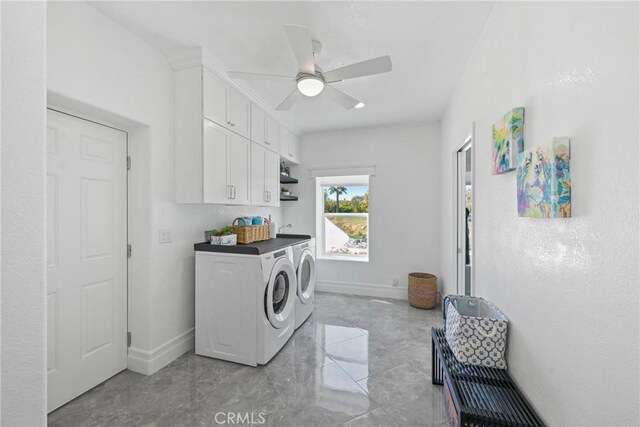 22252 Monte Rancho Dr, Temecula, CA 92590 - laundry room featuring independent washer and dryer, cabinet space, baseboards, and light marble finish flooring