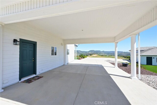 22252 Monte Rancho Dr, Temecula, CA 92590 - view of patio with a mountain view and a carport