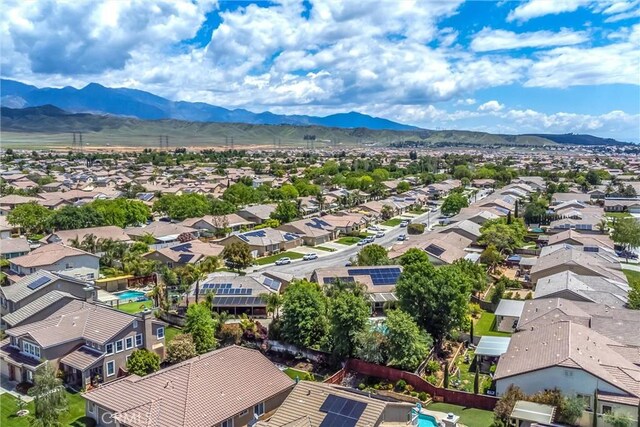 aerial view of residential area with mountains