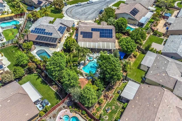 view of property location featuring a pool area and nearby suburban area