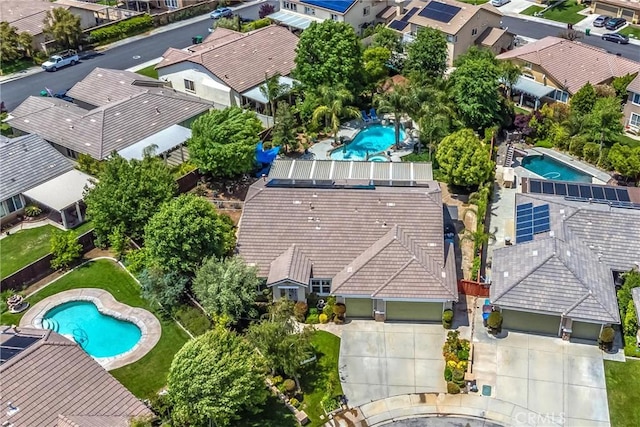 aerial view of residential area featuring a pool