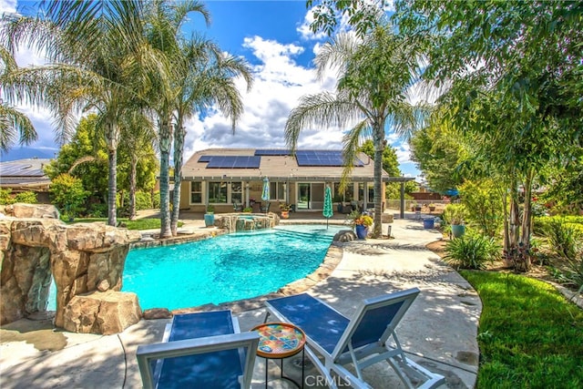 view of pool featuring a patio and a pool with connected hot tub