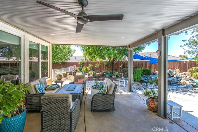 view of patio / terrace featuring a fenced backyard, an outdoor hangout area, and ceiling fan