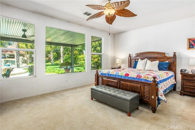 carpeted bedroom with a ceiling fan