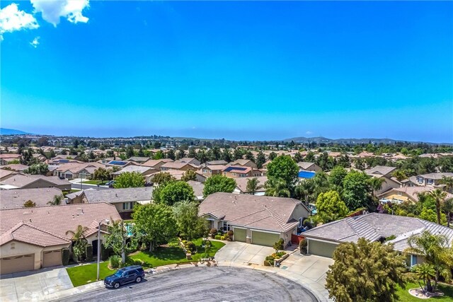 aerial perspective of suburban area with a mountainous background