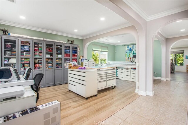 office space featuring arched walkways, healthy amount of natural light, recessed lighting, light wood-type flooring, and ornamental molding