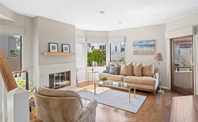 444 30th St, Manhattan Beach, CA 90266 - living area with wood-type flooring, a fireplace with flush hearth, and baseboards