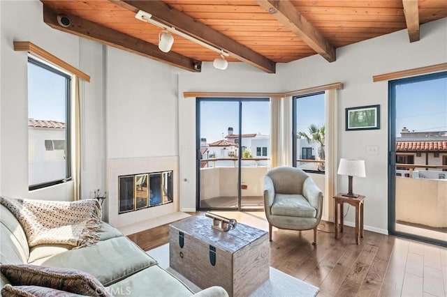 444 30th St, Manhattan Beach, CA 90266 - living room featuring wood ceiling, a fireplace with flush hearth, wood finished floors, beamed ceiling, and baseboards