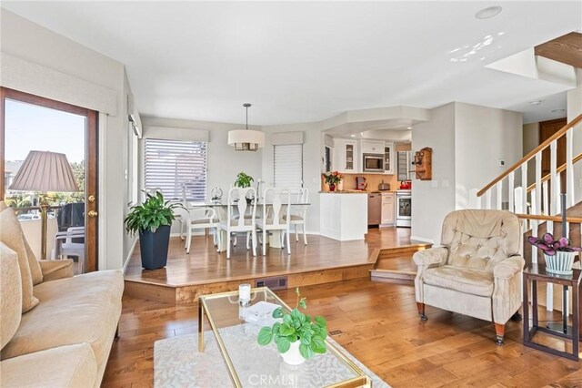 444 30th St, Manhattan Beach, CA 90266 - living area featuring light wood-type flooring, stairway, and baseboards