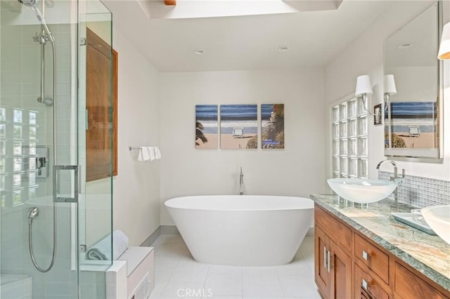 444 30th St, Manhattan Beach, CA 90266 - bathroom with a shower stall, a soaking tub, tile patterned floors, and double vanity