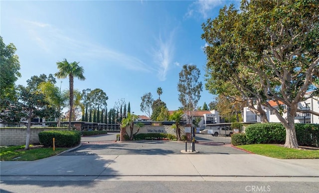 215 Wichita Ave Unit 106, Huntington Beach, CA 92648 - view of road featuring a gate, a residential view, and a gated entry