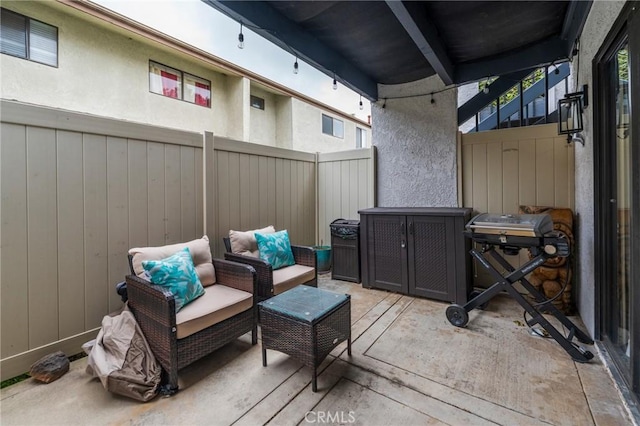 deck featuring fence and an outdoor living space