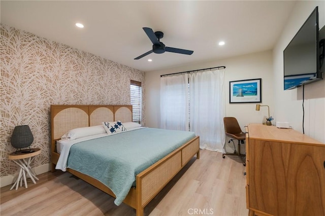 215 Wichita Ave Unit 106, Huntington Beach, CA 92648 - bedroom with wallpapered walls, light wood-style flooring, recessed lighting, an accent wall, and ceiling fan
