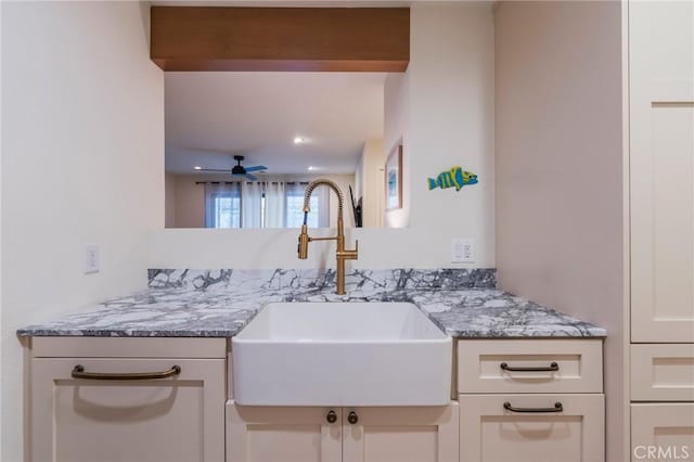 215 Wichita Ave Unit 106, Huntington Beach, CA 92648 - kitchen with light stone counters and ceiling fan
