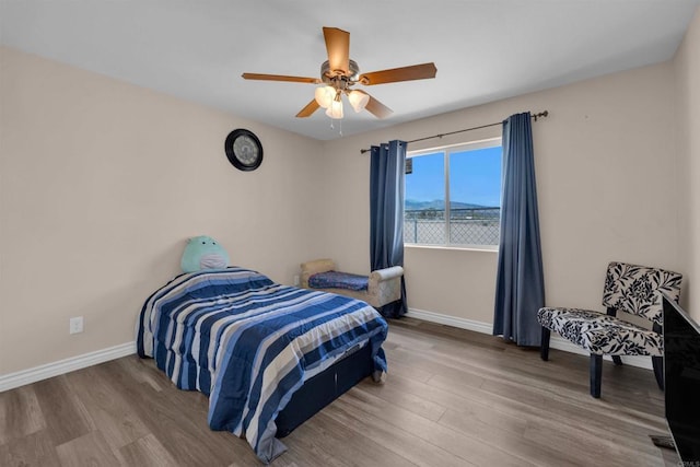 11374 Desert View Rd, Pinon Hills, CA 92372 - bedroom with wood finished floors, baseboards, and ceiling fan
