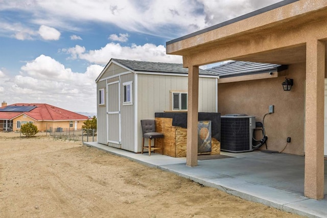 11374 Desert View Rd, Pinon Hills, CA 92372 - view of outdoor structure featuring central AC unit and fence