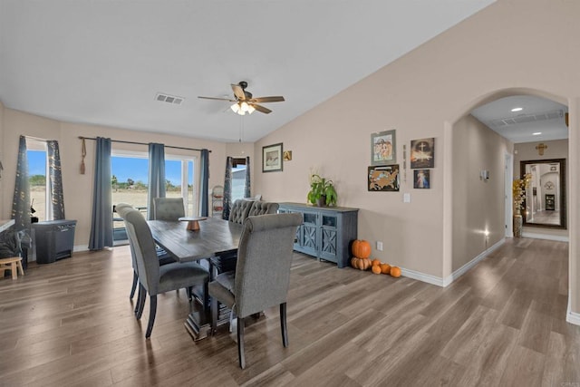 11374 Desert View Rd, Pinon Hills, CA 92372 - dining space featuring wood finished floors, arched walkways, a ceiling fan, baseboards, and vaulted ceiling