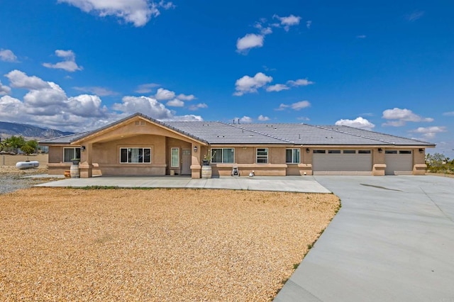 11374 Desert View Rd, Pinon Hills, CA 92372 - ranch-style home featuring stucco siding, an attached garage, driveway, and a tiled roof