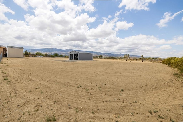 11374 Desert View Rd, Pinon Hills, CA 92372 - view of yard featuring a mountain view and an outbuilding