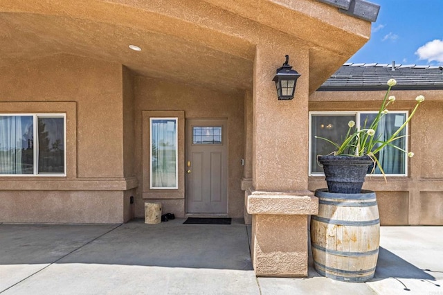11374 Desert View Rd, Pinon Hills, CA 92372 - entrance to property featuring stucco siding and a patio area
