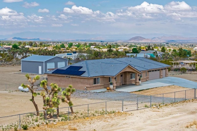 11374 Desert View Rd, Pinon Hills, CA 92372 - single story home featuring driveway, a fenced front yard, a mountain view, an attached garage, and stucco siding