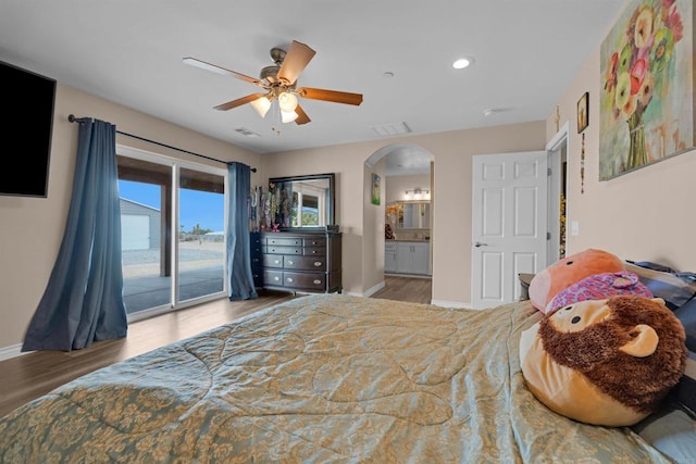 11374 Desert View Rd, Pinon Hills, CA 92372 - bedroom with access to outside, baseboards, wood finished floors, arched walkways, and ensuite bathroom
