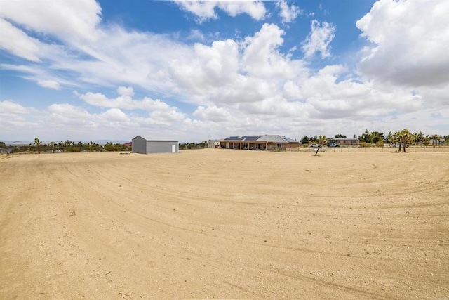 11374 Desert View Rd, Pinon Hills, CA 92372 - view of yard with a garage and an outbuilding