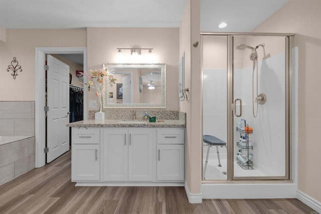 11374 Desert View Rd, Pinon Hills, CA 92372 - full bath with a shower stall, wood finished floors, vanity, a spacious closet, and baseboards