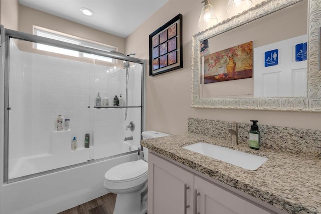 11374 Desert View Rd, Pinon Hills, CA 92372 - full bathroom with vanity, toilet, shower / bath combination with glass door, and wood finished floors