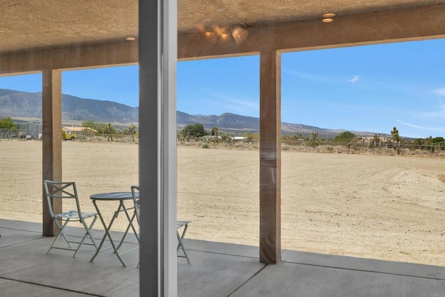 11374 Desert View Rd, Pinon Hills, CA 92372 - doorway with a mountain view and concrete floors