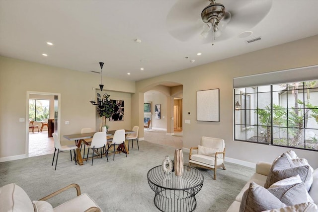 3522 Lancewood Way, Fallbrook, CA 92028 - living area featuring arched walkways, carpet flooring, recessed lighting, ceiling fan, and baseboards