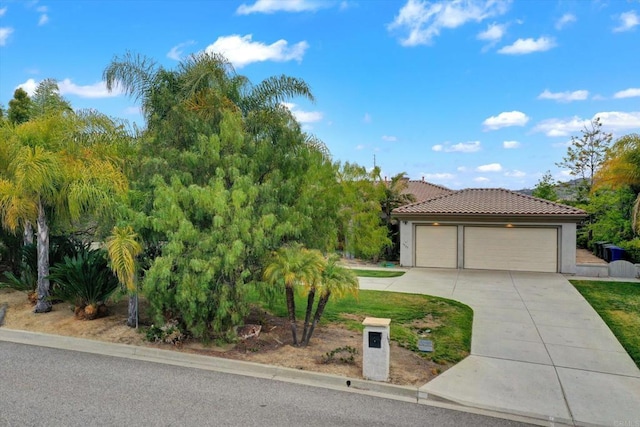 3522 Lancewood Way, Fallbrook, CA 92028 - view of front of property featuring a tiled roof, driveway, stucco siding, and a garage