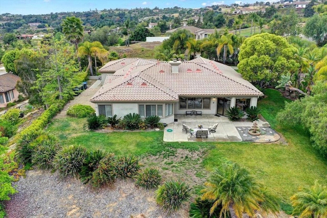 3522 Lancewood Way, Fallbrook, CA 92028 - back of house featuring a tile roof, a yard, stucco siding, a patio area, and a chimney