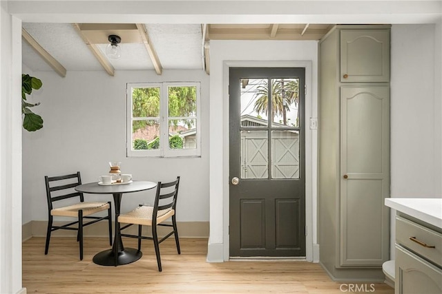 5738 7th Ave, Los Angeles, CA 90043 - dining room with light wood-style floors, beamed ceiling, and baseboards