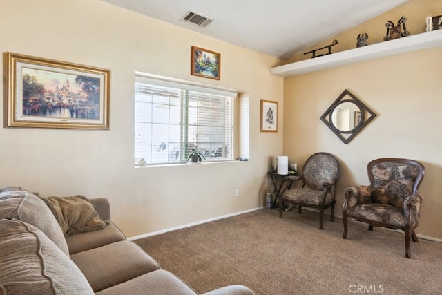 living area with carpet, vaulted ceiling, and baseboards