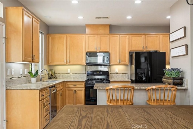 1682 Beaver Unit B, Beaumont, CA 92223 - kitchen featuring black appliances, a sink, recessed lighting, light stone counters, and light brown cabinetry