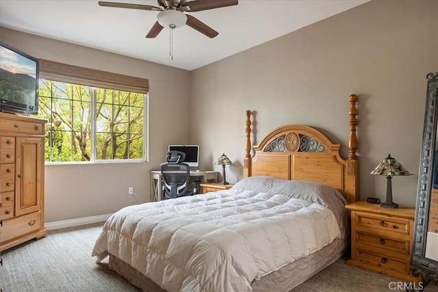 bedroom with carpet flooring, baseboards, and ceiling fan